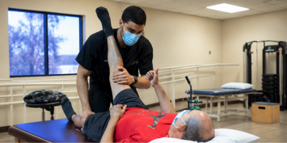 Hands-on leg therapy session at West Texas Therapeutic Services
